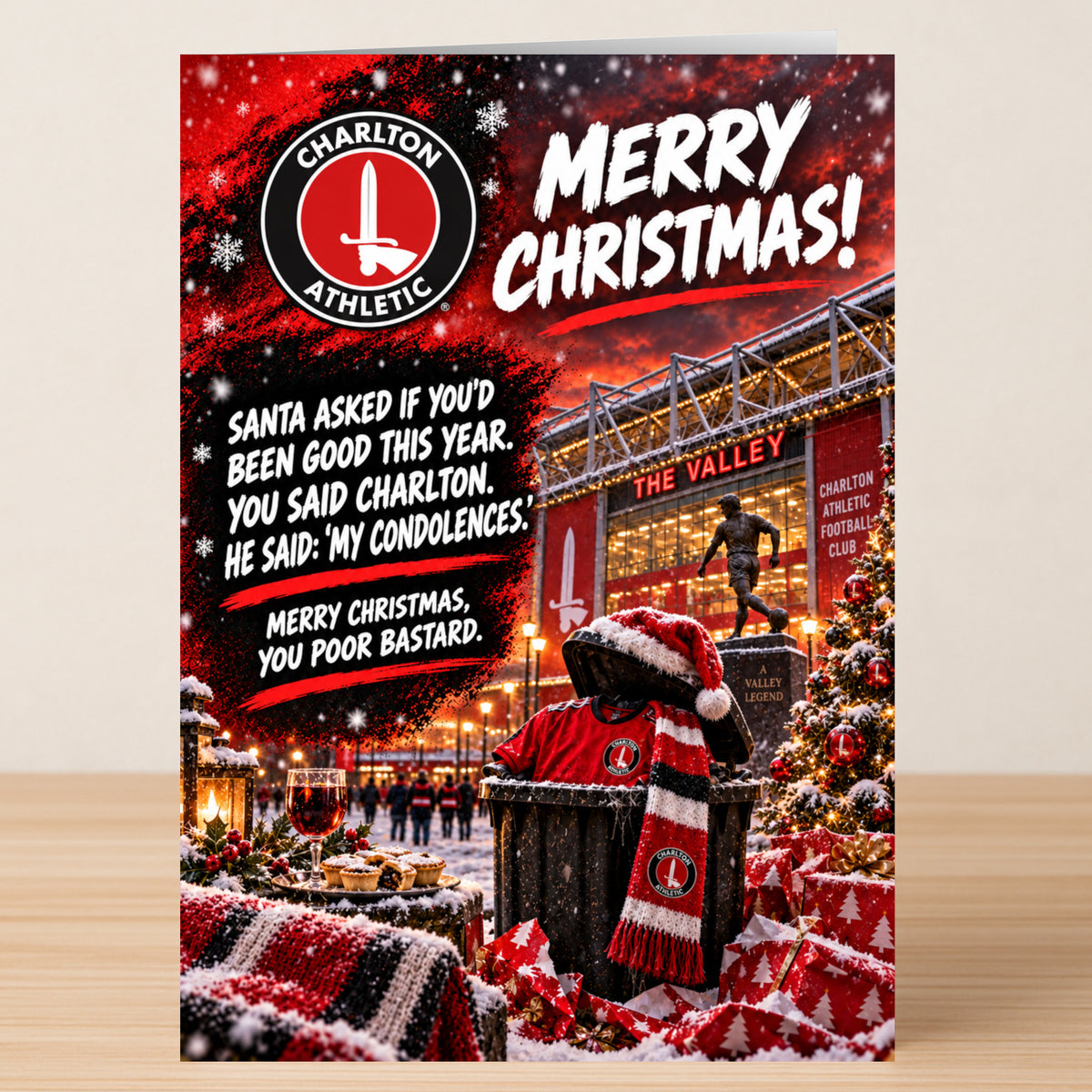 Charlton Athletic – Funny Christmas Card featuring the club logo, stadium, and a trash can in a Santa hat, with text reading: “Santa asked if you’d been good. You said Charlton. My condolences.”
