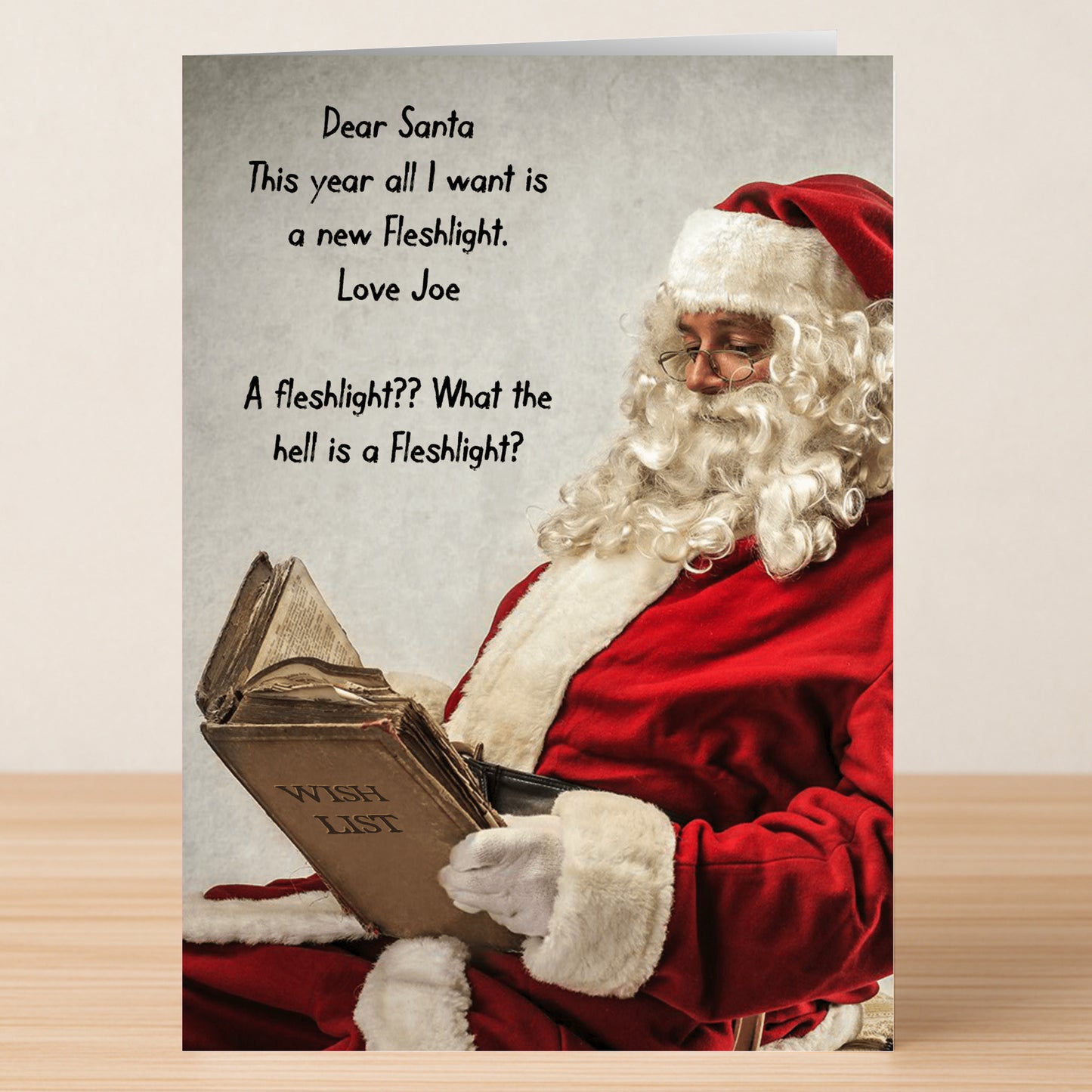 The Wish List Rude Christmas Card by Twisted Gifts features a funny Santa reading a giant wish list with a cheeky letter about requesting a Fleshlight, all printed on high-quality materials.
