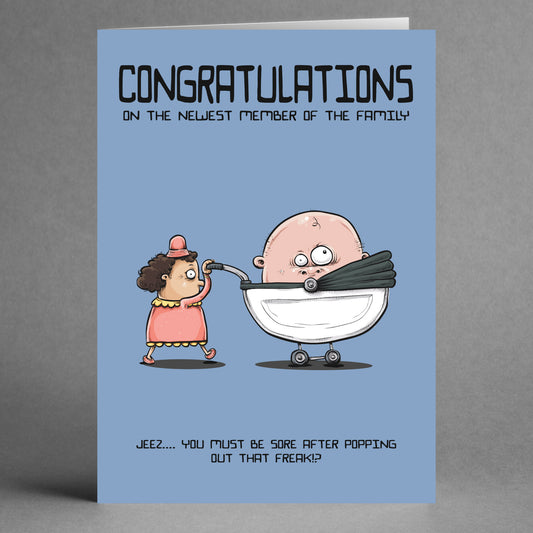Freak Insulting Congratulations Card by Twisted Gifts: Features a woman in a dress pushing a giant baby in a stroller, with "Congratulations on the newest member of the family" and a cheeky comment—ideal funny card for new mums.