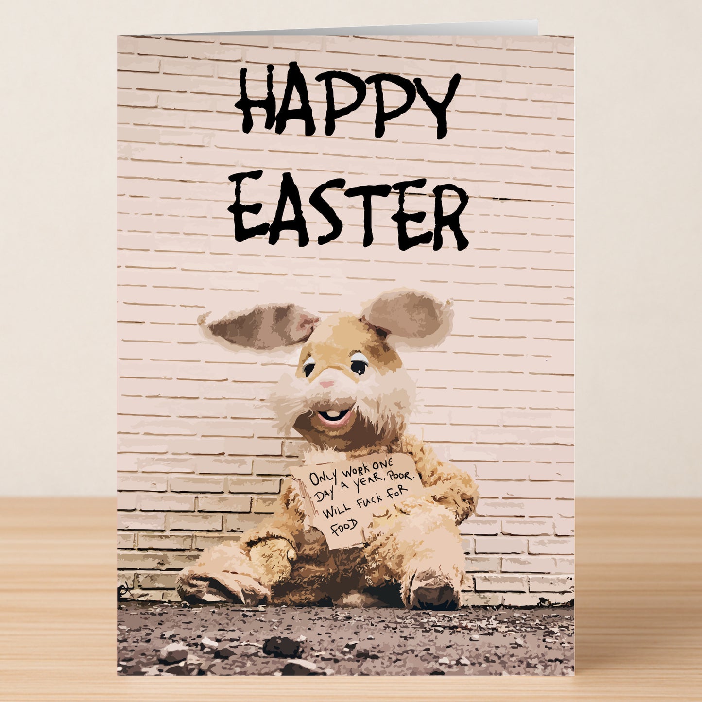 The Twisted Gifts "Fuck For Food Rude Easter Card" features a person in a shabby Easter Bunny suit holding a hilarious sign and is perfect for sharing some cheeky humor this holiday!.