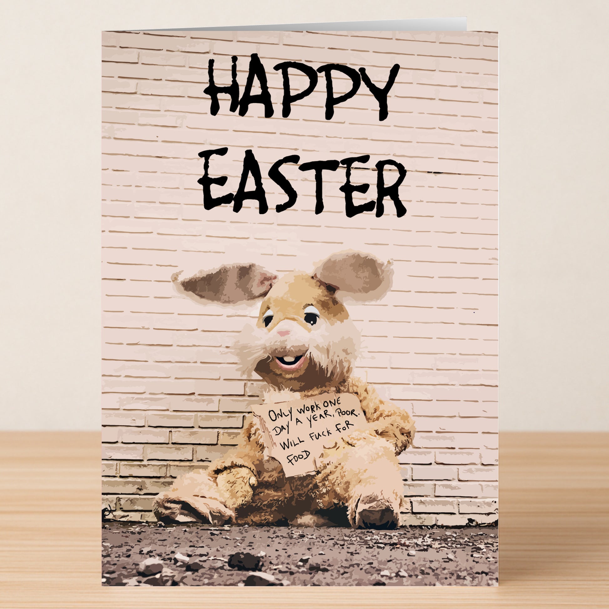 The Twisted Gifts "Fuck For Food Rude Easter Card" features a person in a shabby Easter Bunny suit holding a hilarious sign and is perfect for sharing some cheeky humor this holiday!.