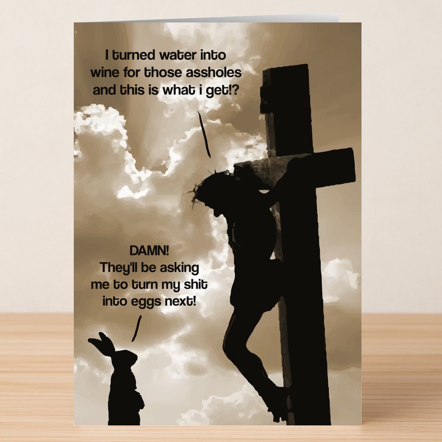 The Water To Wine Rude Easter Card by Twisted Gifts features a sepia Easter scene of Jesus on the cross joking with an Easter bunny about turning water into wine and eggs.