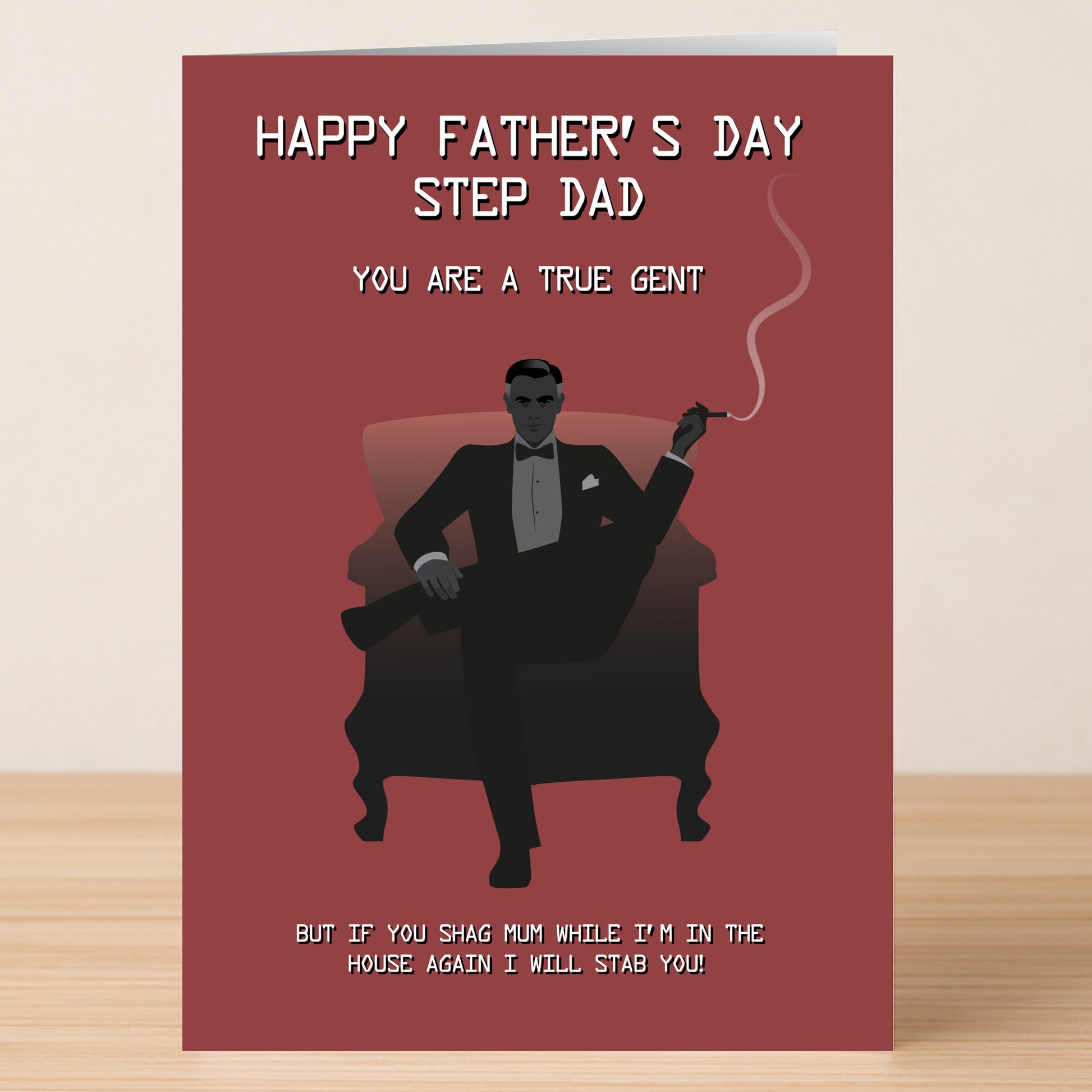 The Twisted Gifts "Stab Rude Father's Day Card" shows a sharply dressed man smoking in a chair. This sarcastic card is perfect for stepdads, featuring a witty, slightly threatening message at the bottom for extra laughs.