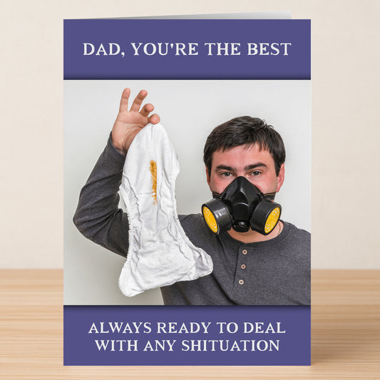 A man in a respirator holds up a stained diaper. Text: "Dad, you're the best. Always ready for any shituation." Any Shituation Rude Father’s Day Card by Twisted Gifts—perfect rude or unique card for Father's Day!.