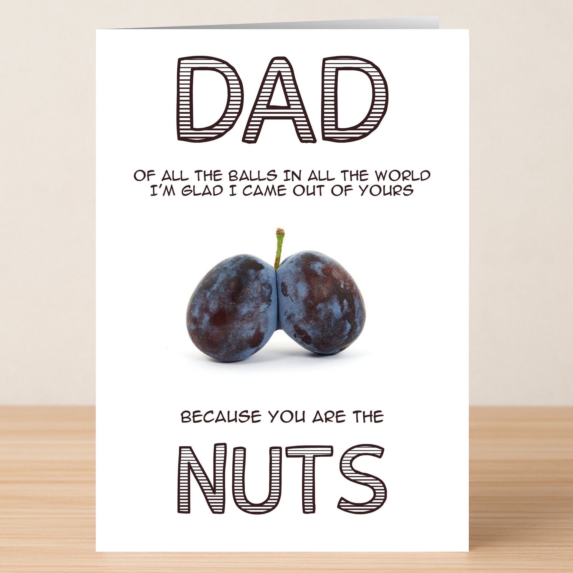 The Best Nuts Funny Father's Day Card by Twisted Gifts reads, "Dad, of all the balls in all the world I'm glad I came out of yours because you are the nuts," with two plums for a hilarious card he'll love.