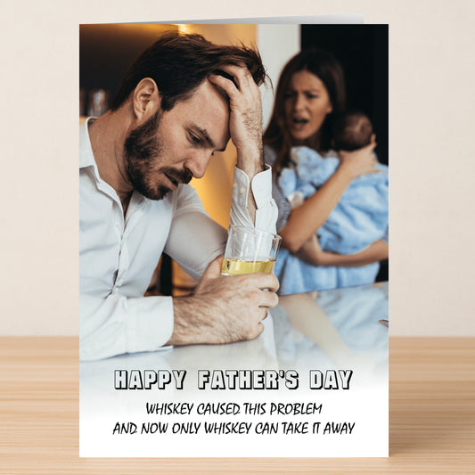 A man looks stressed with whiskey in hand as a woman holds a baby in the background. "Happy Father's Day" text adds humor to this Whiskey Funny Father's Day Card by Twisted Gifts—a quirky choice for dads who need a laugh.