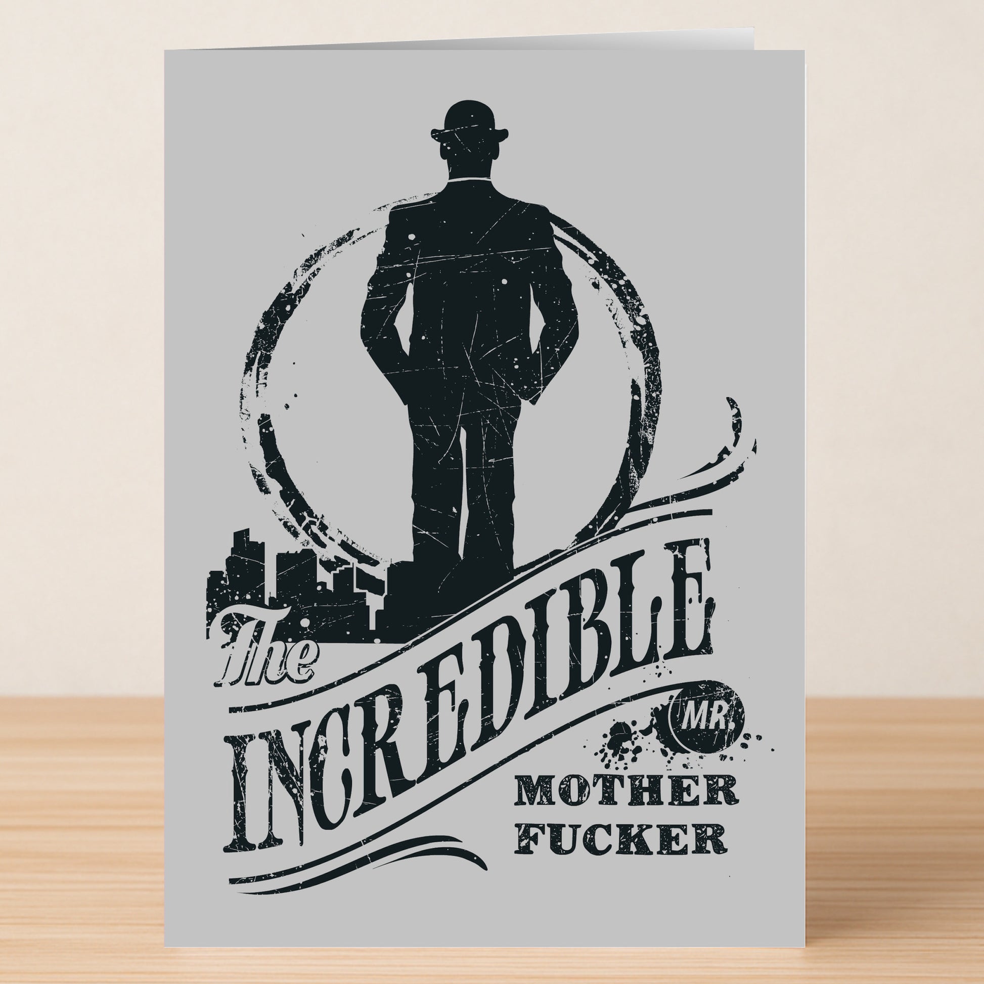 Twisted Gifts' Mr Incredible Insulting Father's Day Card features a black silhouette of a man in a suit and hat with the bold text “The Incredible Mr. Mother Fucker”—the perfect humorous card for the Mr. Incredible dad in your life.