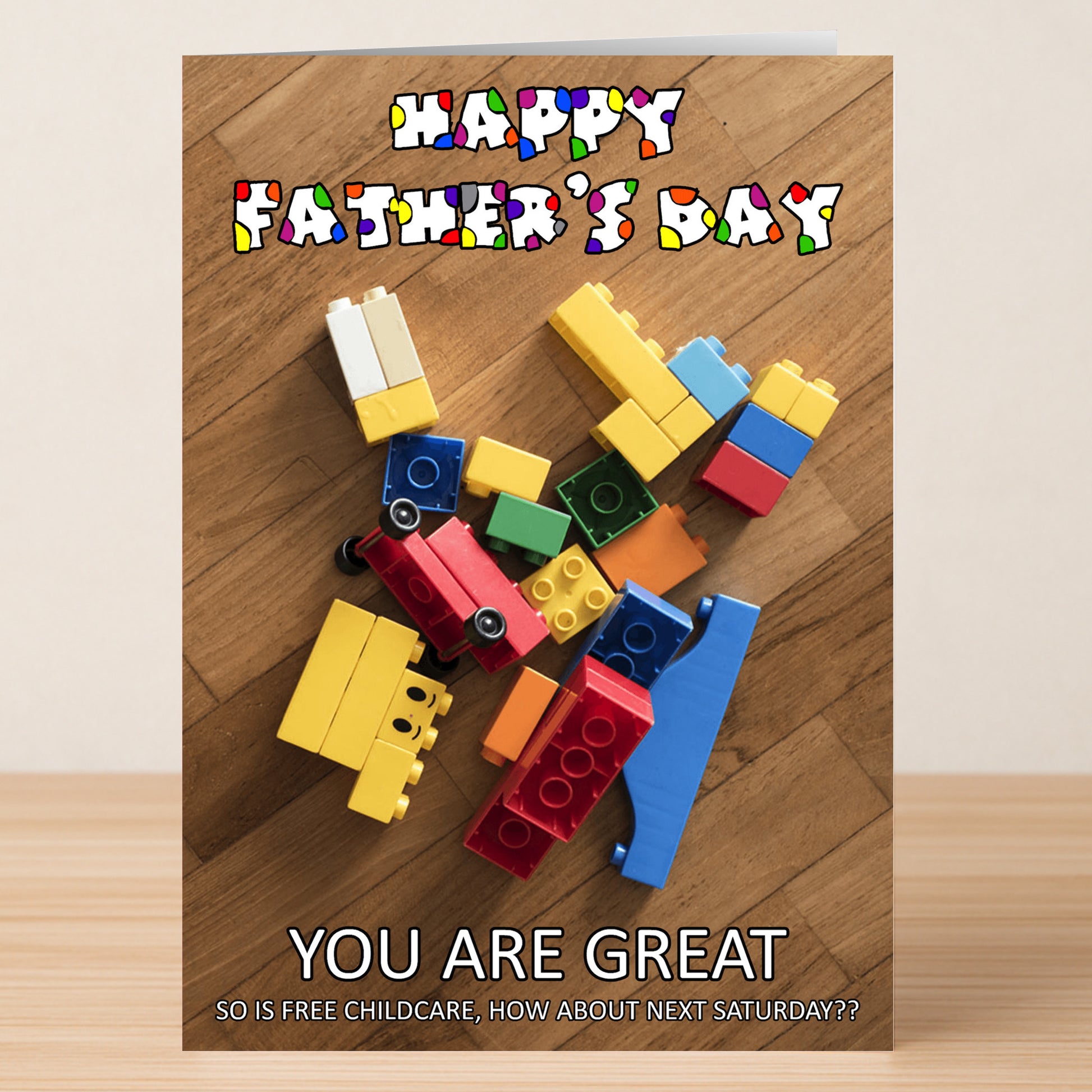 The Free Childcare Funny Father's Day Card by Twisted Gifts features colorful toy blocks and the message, "Happy Father's Day. You are great. So is free childcare, how about next Saturday??" A unique card sure to make him smile!.