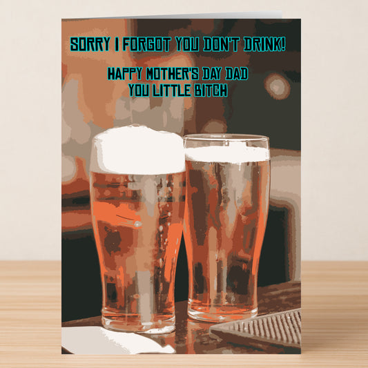 The Doesn’t Drink Funny Father’s Day Card by Twisted Gifts features two pints of beer on wood with playful text, humorously noting “Dad” doesn’t drink and wishing a cheeky Happy Father’s Day.