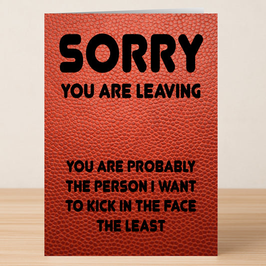 Twisted Gifts’ Kick In The Face Funny Farewell Card features a textured red-brown background with bold black text: "SORRY YOU ARE LEAVING. YOU ARE PROBABLY THE PERSON I WANT TO KICK IN THE FACE THE LEAST." A humorous way to say goodbye.