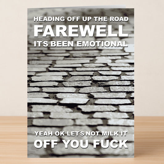 The Up The Road Funny Farewell Card from Twisted Gifts features a cobblestone background and bold white text: "Farewell, it's been emotional. Yeah OK let's not milk it, off you fuck." A hilarious card for memorable goodbyes.