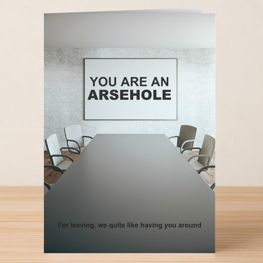 The Arsehole Funny Farewell Card by Twisted Gifts features a conference room with a "YOU ARE AN ARSEHOLE" sign and the message, "For leaving, we quite like having you around." A hilarious card for coworkers.