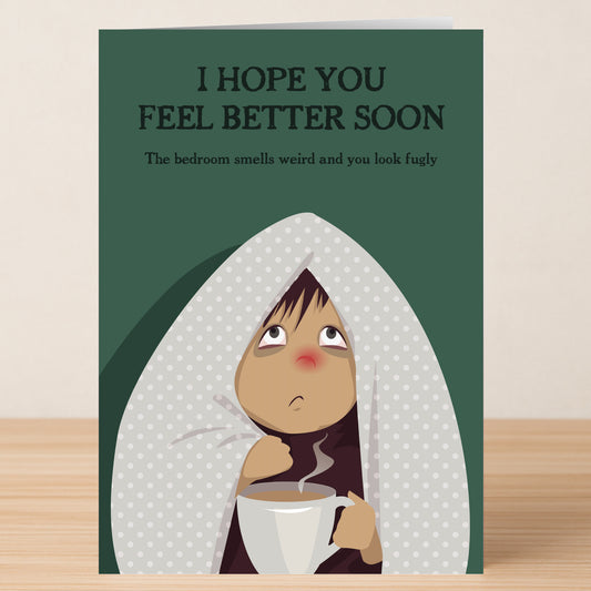 The Smells Weird Rude Get Well Soon Card by Twisted Gifts features a sickly figure under a spotted blanket with the text: "I HOPE YOU FEEL BETTER SOON. The bedroom smells weird and you look fugly." A hilarious way to wish recovery!.