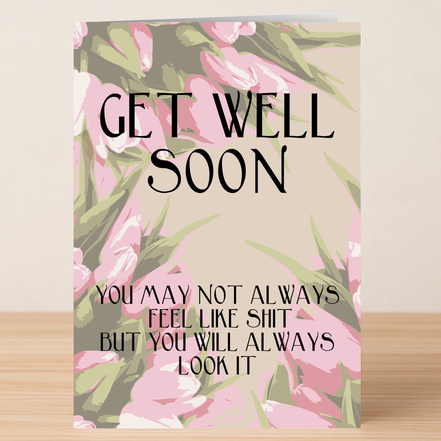 Cheer them up with the "Look Like Shit Insulting Get Well Soon Card" from Twisted Gifts—a pink and green floral card with a cheeky message guaranteed to make anyone laugh.