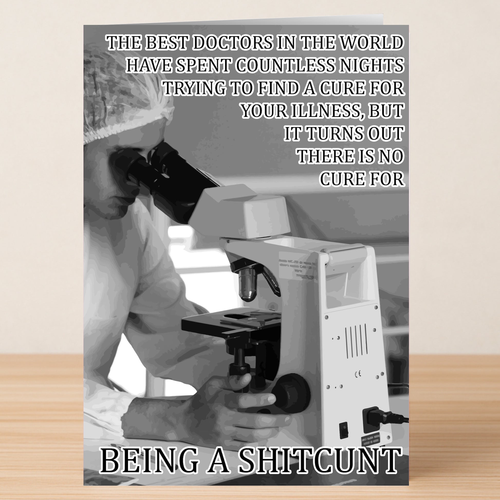 Dressed in protective gear, someone peers through a microscope with text joking there’s no cure for “being a shitcunt”—the perfect No Cure Insulting Get Well Soon Card by Twisted Gifts for anyone who loves dark humor with their healing.
