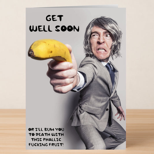 The Phallic Fruit Rude Get Well Soon Card by Twisted Gifts shows a man in a suit aiming a banana like a gun, with edgy text for those who enjoy bold humor—perfect for sending hilarious, cheeky get well wishes.