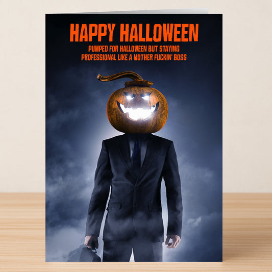 A man in a suit with a glowing pumpkin head holds a briefcase. Text above: "Happy Halloween. Stay professional this spooky season Like A Boss." Like A Boss Funny Halloween Card by Twisted Gifts.
