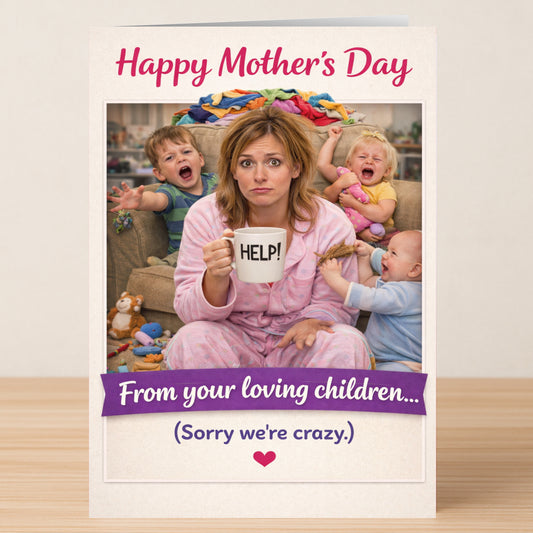 A tired mum in pajamas holds a "HELP!" mug, surrounded by three crying kids and toys, on the Crazy Children Mother's Day Card from Twisted Gifts—a hilarious card packed with Mother’s Day humour.