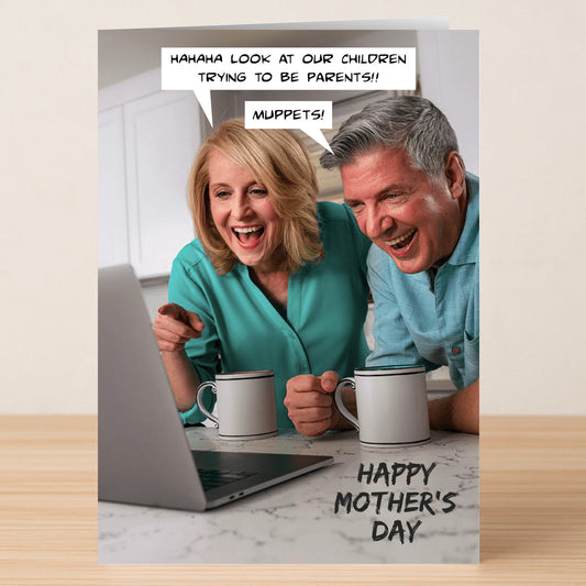 An older couple laughs at a laptop, mugs in hand, with Muppets-style jokes about their kids being parents. "Happy Mother's Day" text below. Twisted Gifts' Muppets Funny Mother's Day Card is perfect for a humorous greeting!.