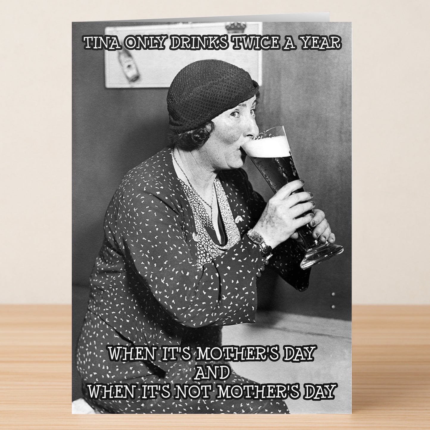 A woman in vintage attire sips beer. Text: "Tina only drinks twice a year: when it's Mother's Day and when it's not Mother's Day." Perfect for Mother’s Day—the Twice A Year Funny Mother’s Day Card by Twisted Gifts.