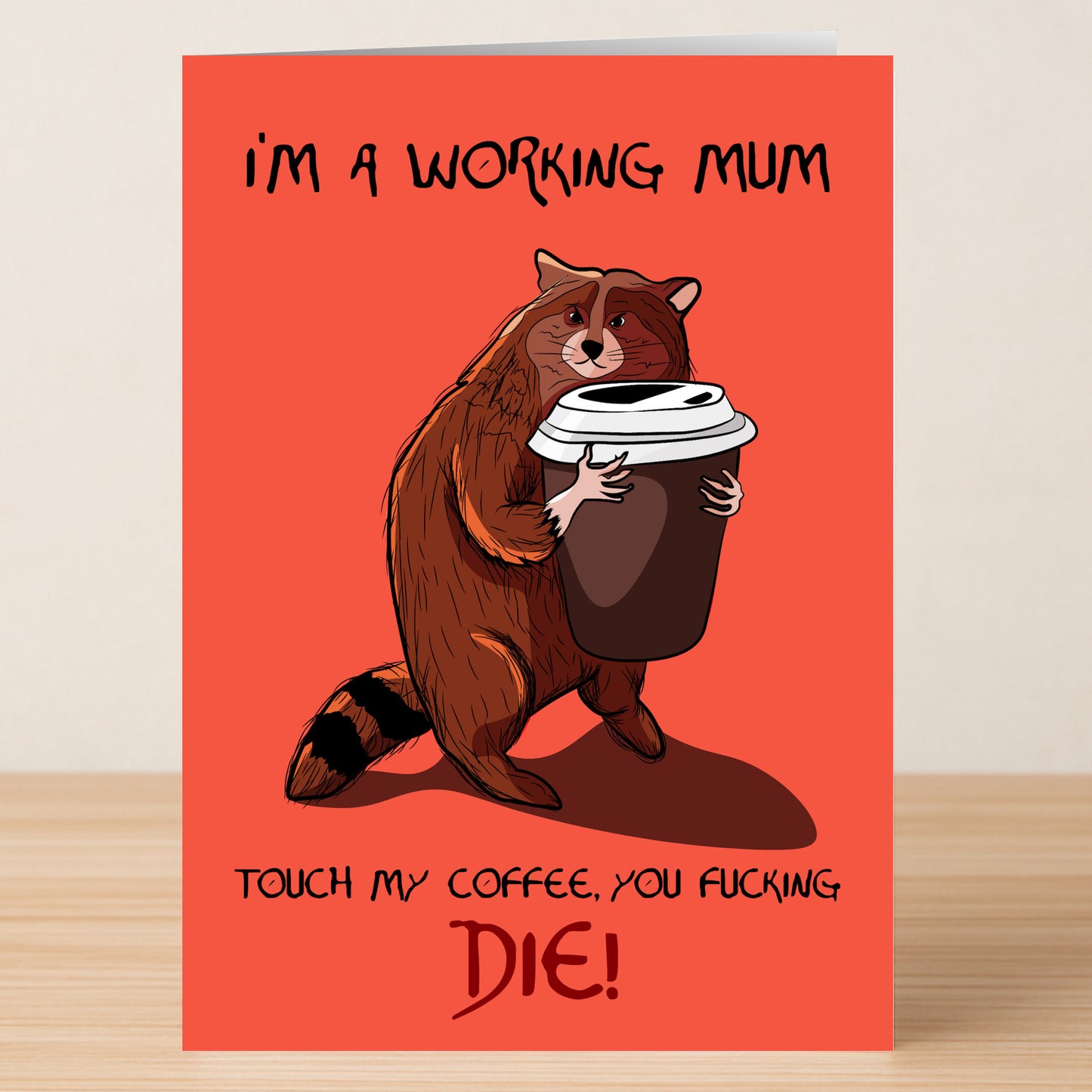 The Twisted Gifts Working Mum Funny Mother's Day Card features a cartoon raccoon hugging a big coffee cup on a red card with "I'M A WORKING MUM" and "TOUCH MY COFFEE, YOU FUCKING DIE!"—perfect for working moms.