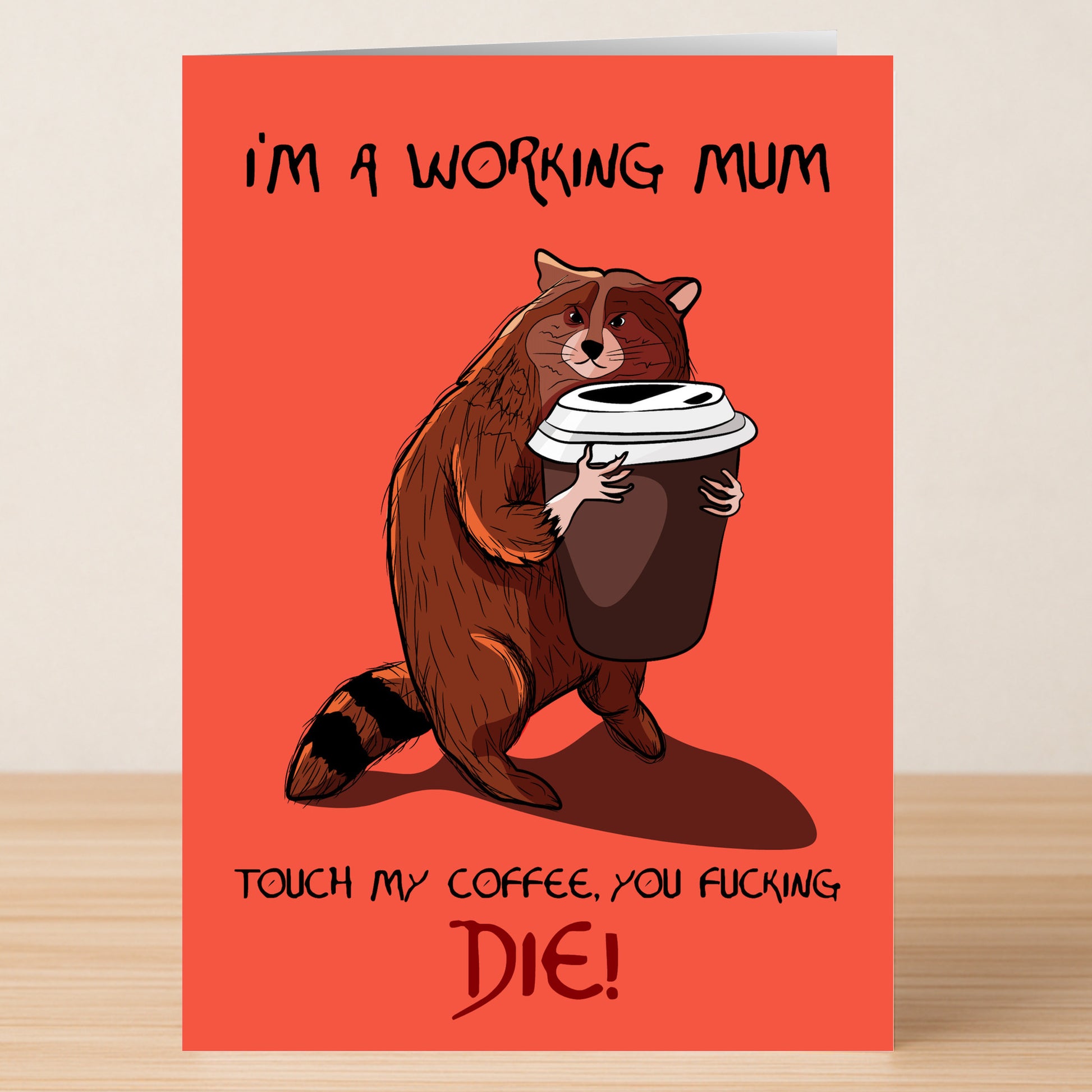 The Twisted Gifts Working Mum Funny Mother's Day Card features a cartoon raccoon hugging a big coffee cup on a red card with "I'M A WORKING MUM" and "TOUCH MY COFFEE, YOU FUCKING DIE!"—perfect for working moms.