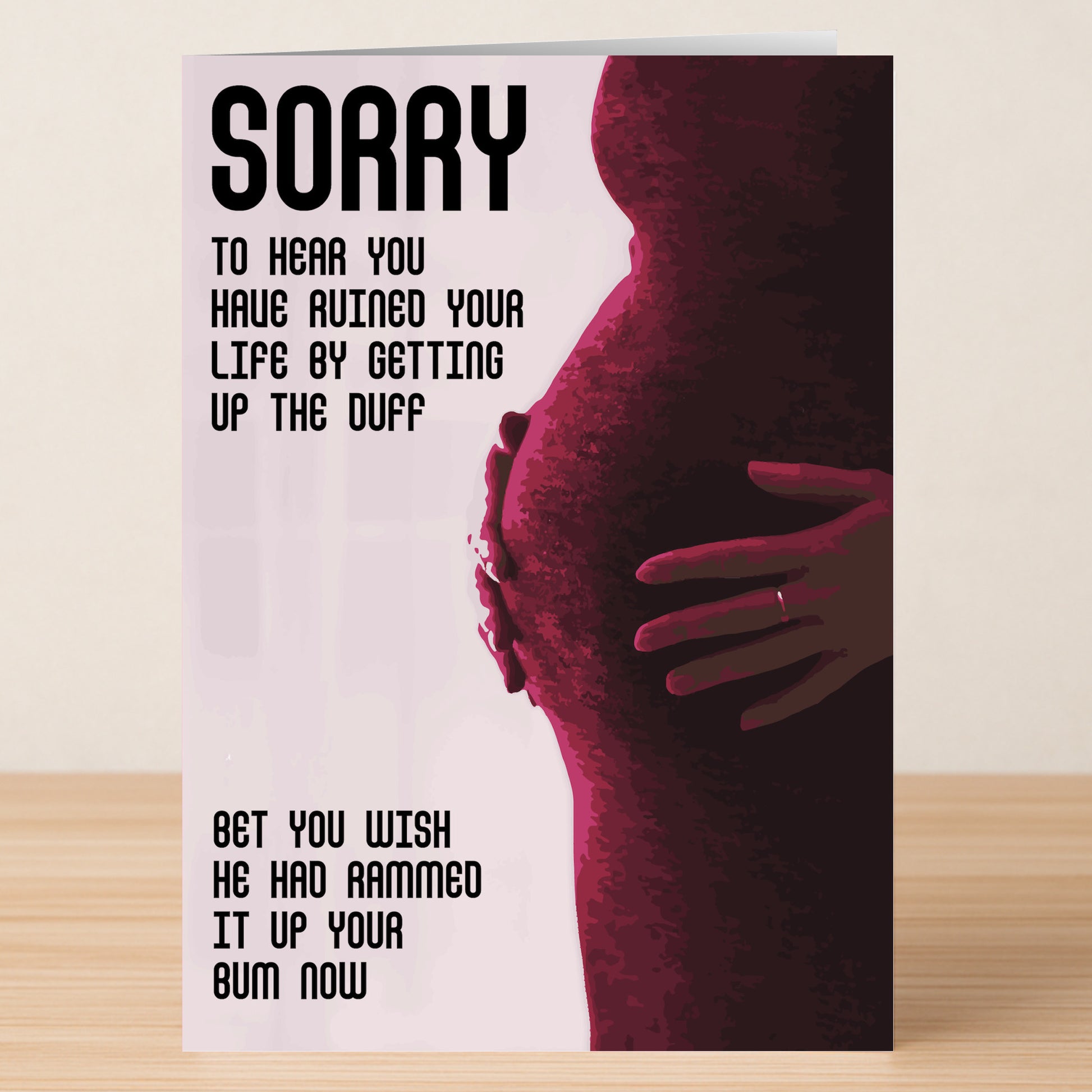 The "Up The Duff Rude Sorry Card" by Twisted Gifts features a pregnant silhouette and a bold, sarcastic pregnancy message—perfect for anyone who appreciates quirky humor.