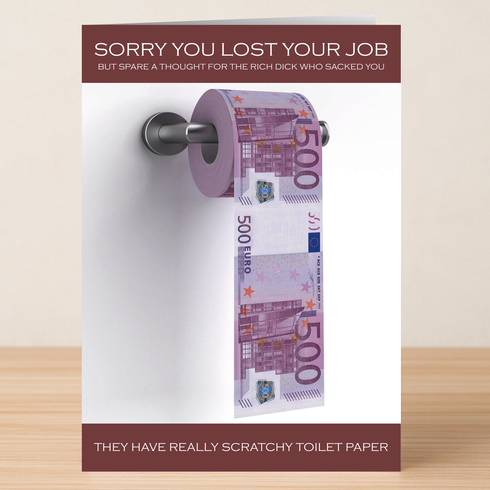 The Scratchy Funny Sorry Card by Twisted Gifts features a toilet paper roll of €500 notes and the message: "Sorry you lost your job, but spare a thought for the rich dick who sacked you. They have really scratchy toilet paper.