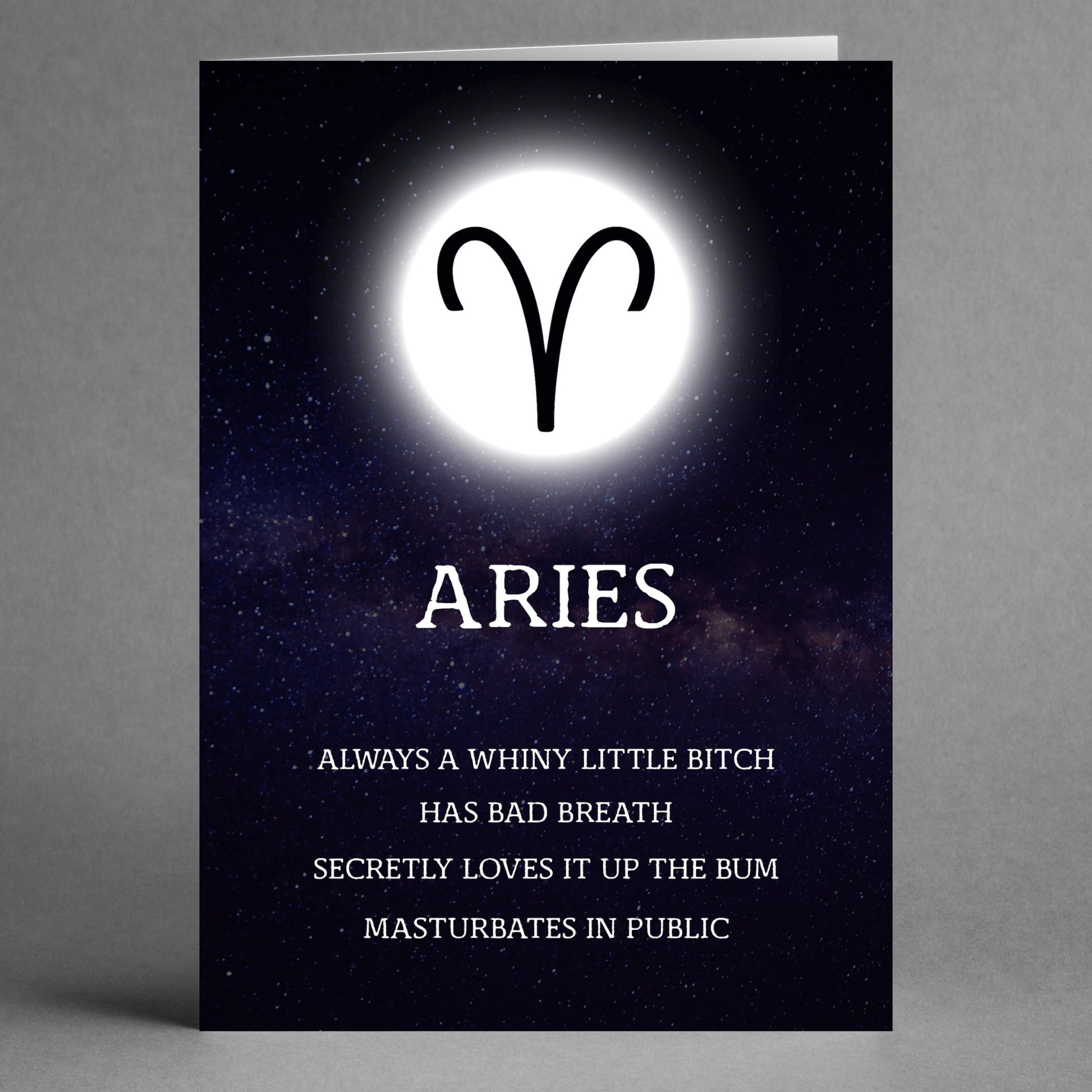 Description of the Aries Rude Star Sign Card by Twisted Gifts: A striking card featuring a glowing Aries symbol and the bold title "ARIES." Beneath it, humorous and provocative text candidly unveils the fiery traits associated with this sign.