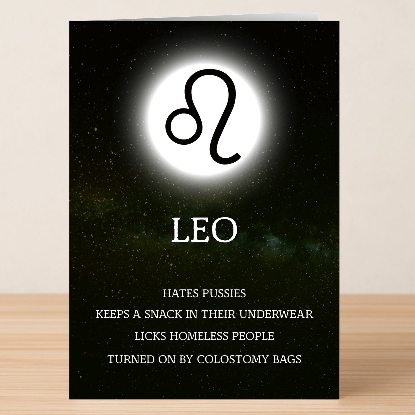 The Leo Rude Star Sign Card by Twisted Gifts features a starry background, the Leo symbol, and humorous, cheeky text listing Leo’s bold and authentic traits.