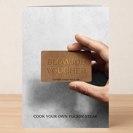 A hand holds Twisted Gifts’ Voucher Rude Steak And Blowjob Card, labeled "BLOWJOB VOUCHER EXPIRES 11.59pm March 14th" with bold "COOK YOUR OWN FUCKIN’ STEAK." A cheeky holiday gag gift for those with a sense of humor.