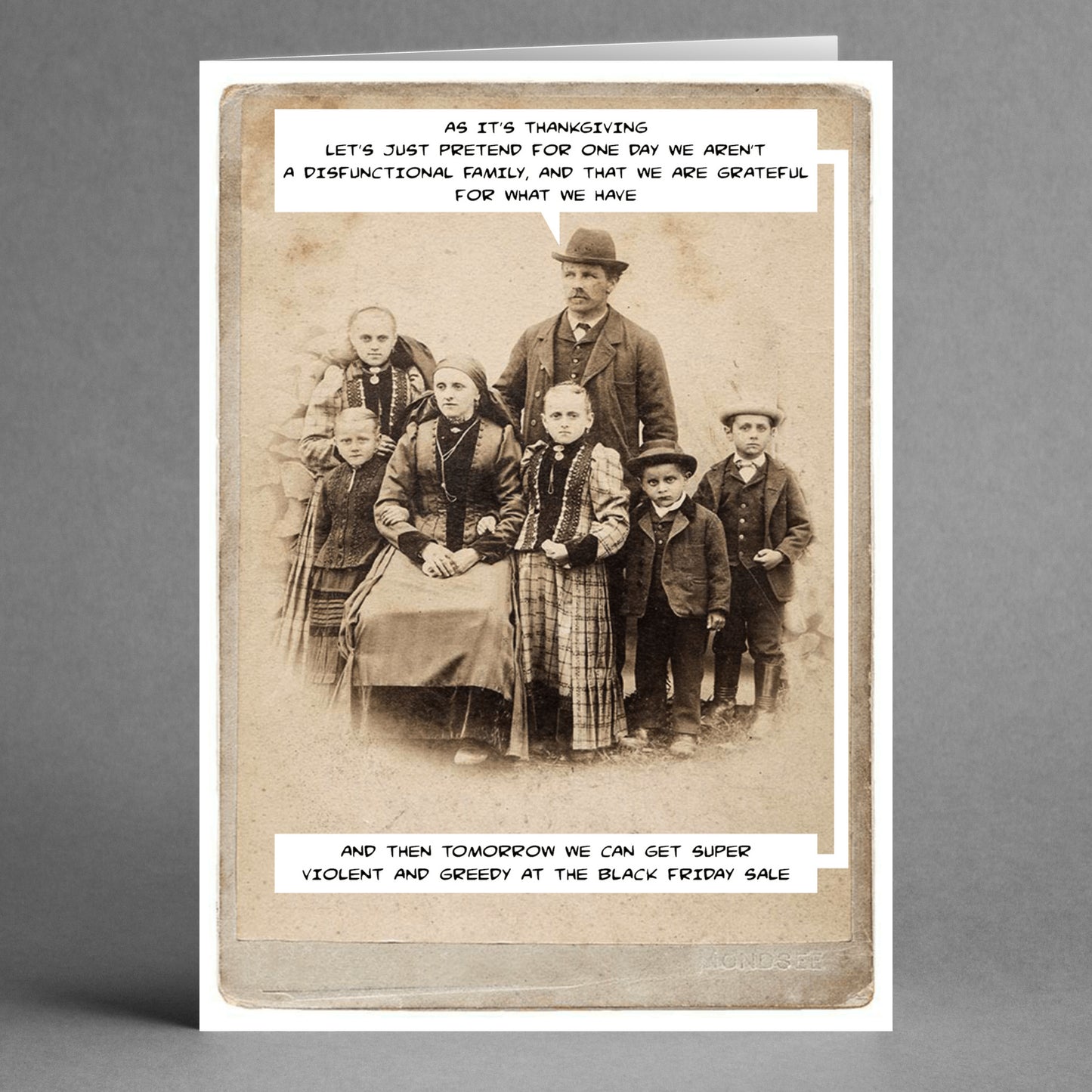 Vintage-style card featuring a family portrait with the words: "Let's just pretend for one day we aren't a dysfunctional family." Below, it humorously states: "Tomorrow, it's humor in action as we get super violent and greedy at the Friday Sale." From Twisted Gifts' 'Friday Sale Insulting Thanksgiving Card.'