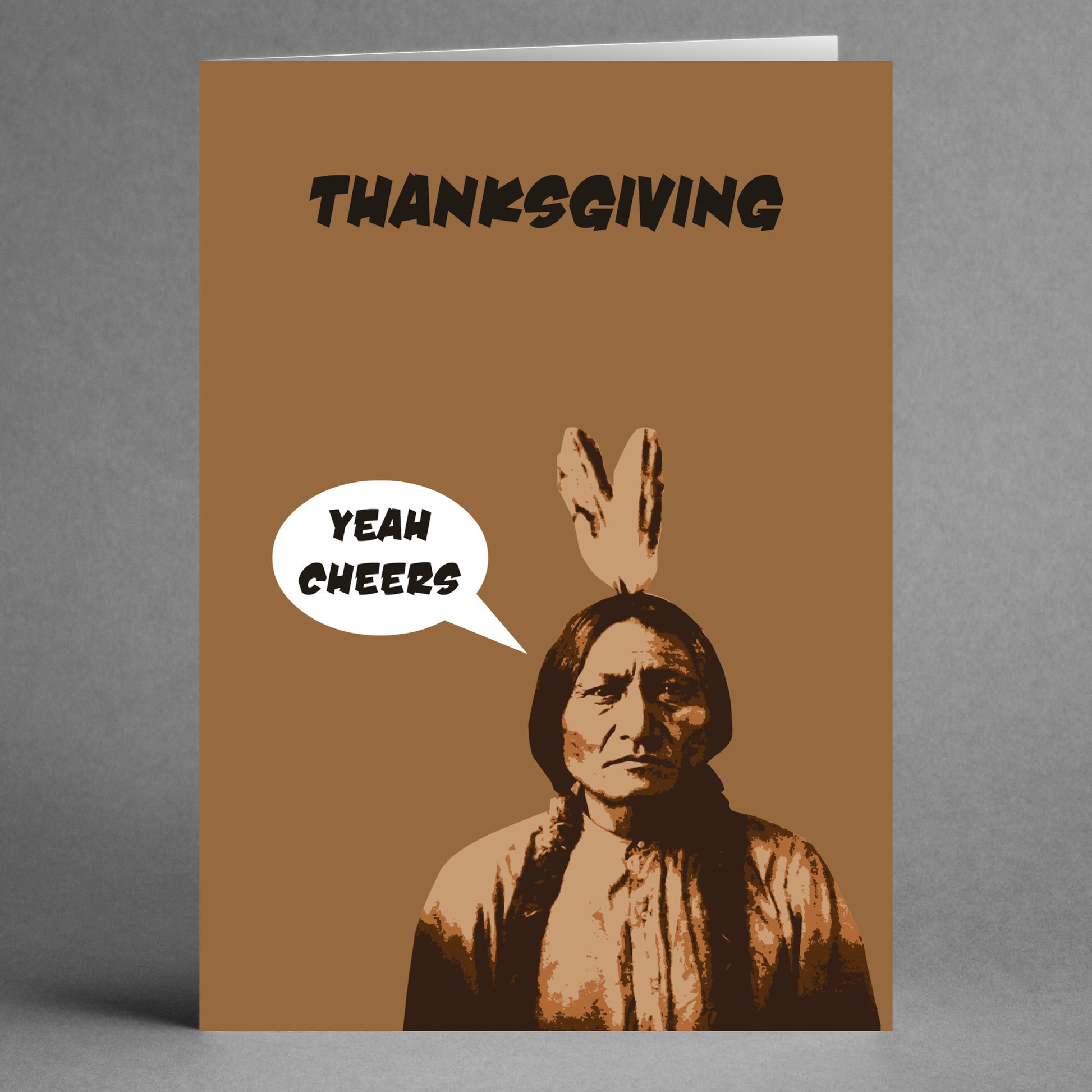 The "Yeah Cheers Funny Thanksgiving Card" by Twisted Gifts showcases a humorous illustration of a person with a speech bubble saying "Yeah Cheers" on a brown background, perfectly capturing the spirit of gratitude with a touch of humor for Thanksgiving.