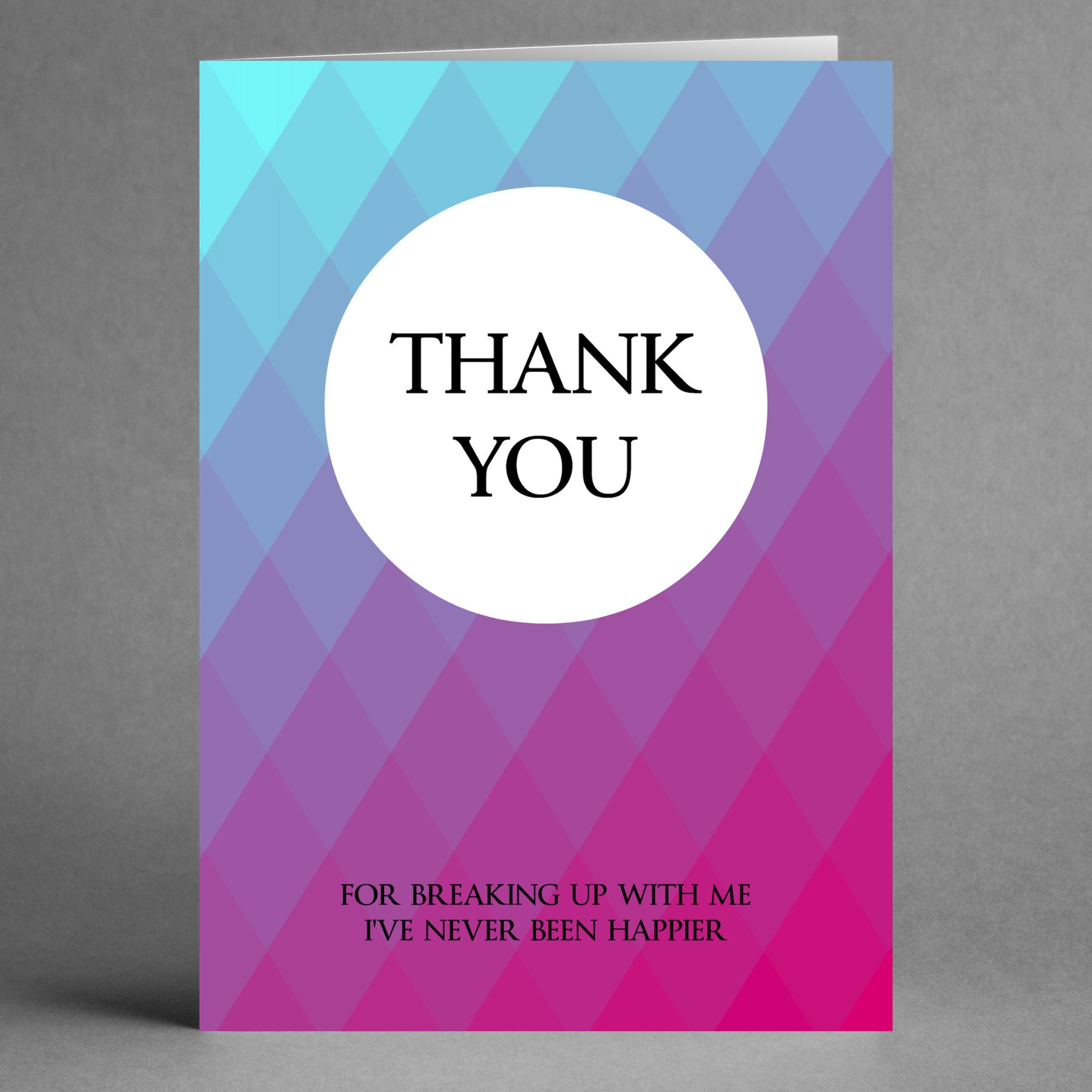 The "Never Happier Funny Thank You Card" by Twisted Gifts is a quirky greeting card that humorously says, "Thank You for breaking up with me. I've never been happier," set against a playful blue and purple diamond pattern. It's the perfect choice for those who enjoy a touch of sarcasm in their greetings.