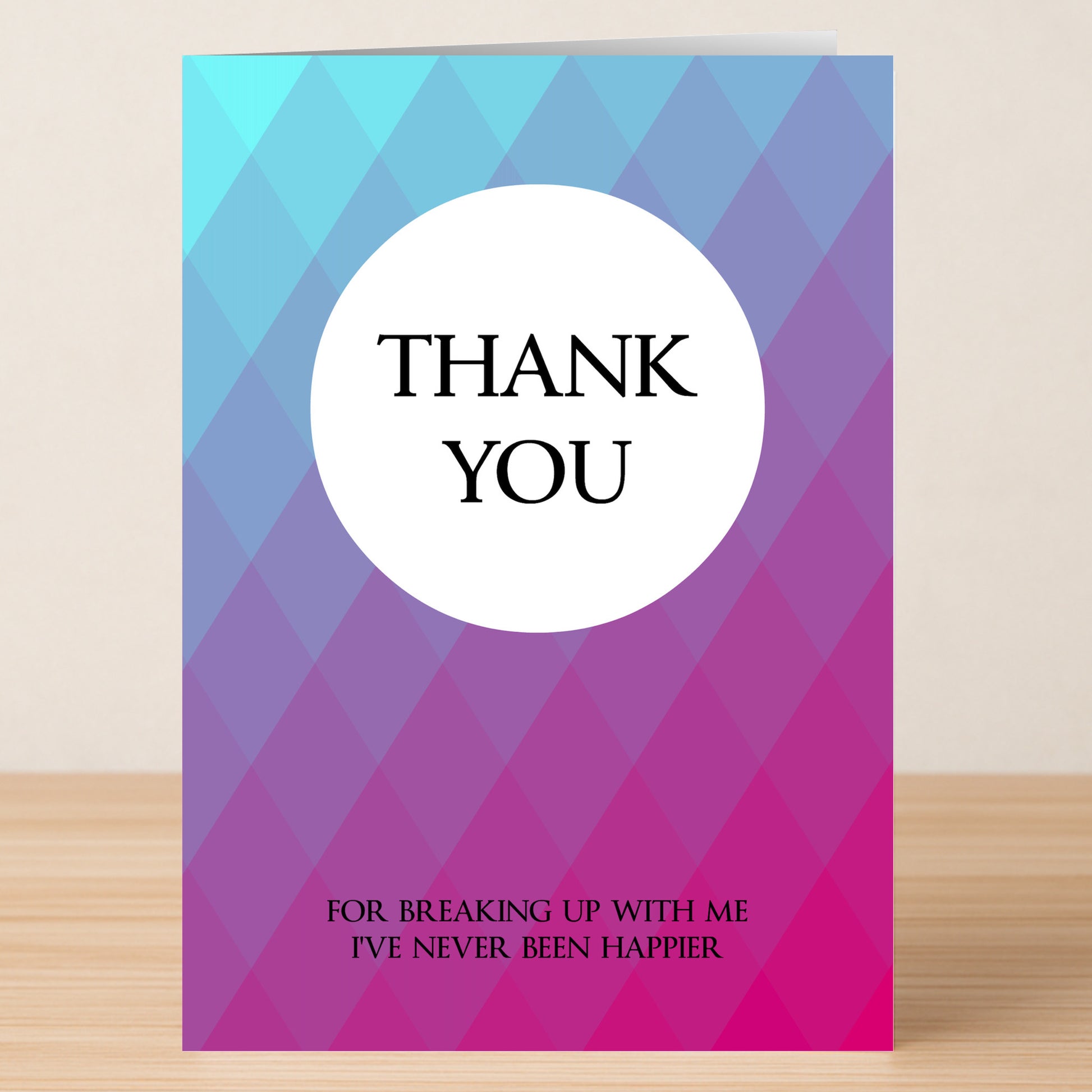 The Never Happier Funny Thank You Card by Twisted Gifts features a blue and purple diamond pattern with "THANK YOU" in a white circle and "For breaking up with me I've never been happier" below—a humorous way to say thanks.