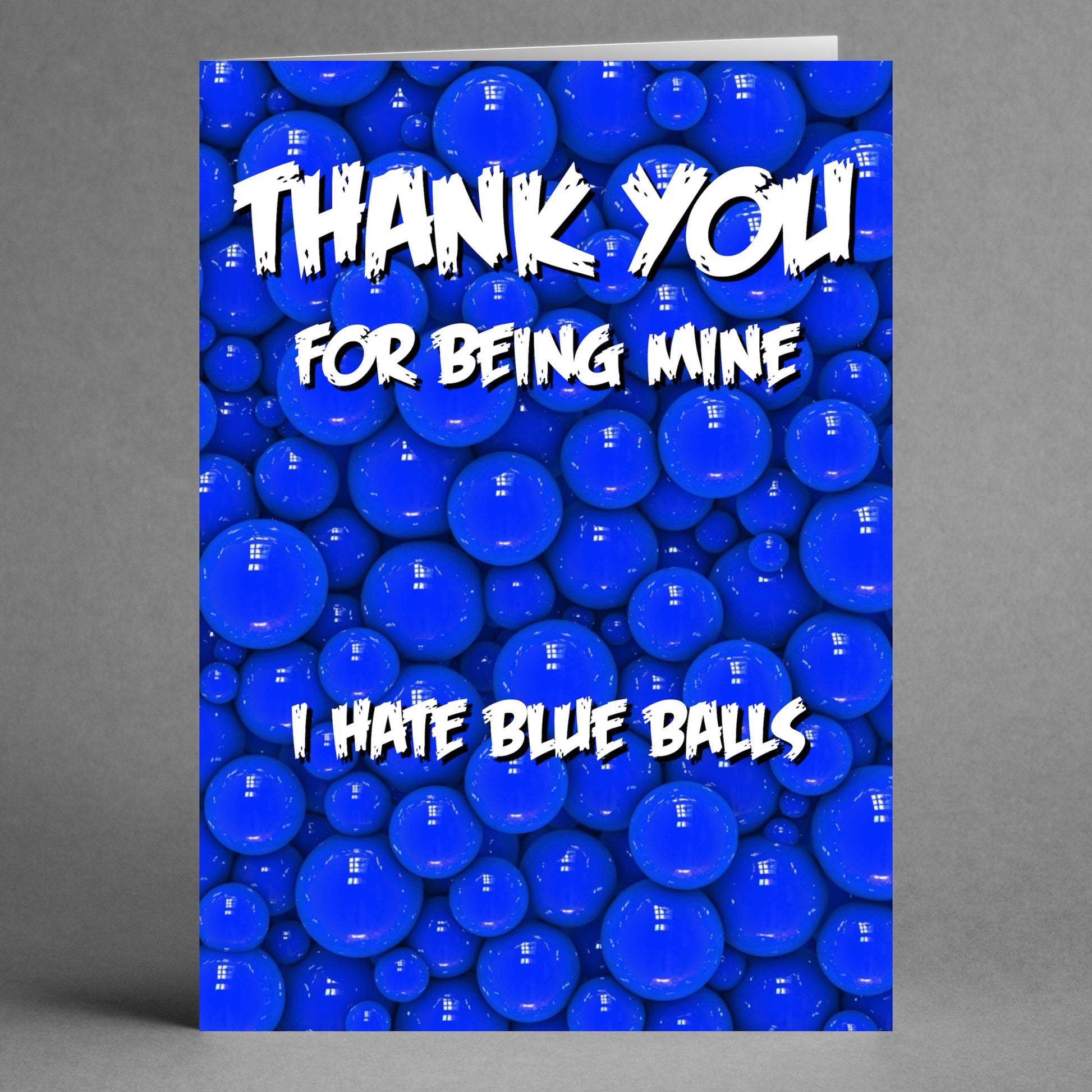 A cheeky card from Twisted Gifts, featuring a blue balls background and playful text: "Thank you for being mine." It's perfect for a sassy thank-you! The "Blue Balls Insulting Thank You Card" adds just the right touch of humor.