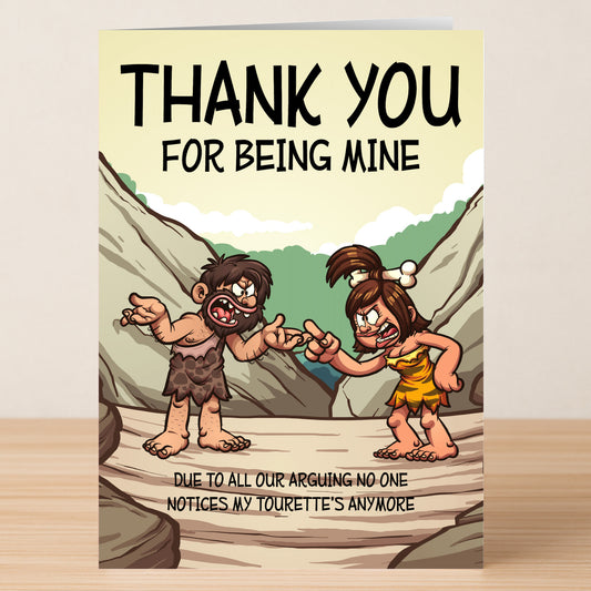 Twisted Gifts’ Tourettes Funny Thank You Card features cartoon cave people arguing with the caption: “THANK YOU FOR BEING MINE. Due to all our arguing, no one notices my Tourette’s anymore.”.