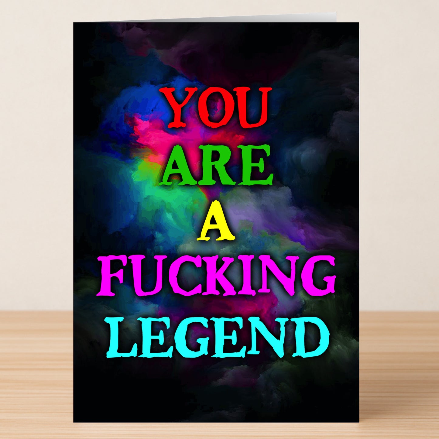 The Fucking Legend Funny Thank You Card by Twisted Gifts features "YOU ARE A FUCKING LEGEND" in bold, colorful letters on a dark, smoky multicolored background—perfect for making your gratitude unforgettable.