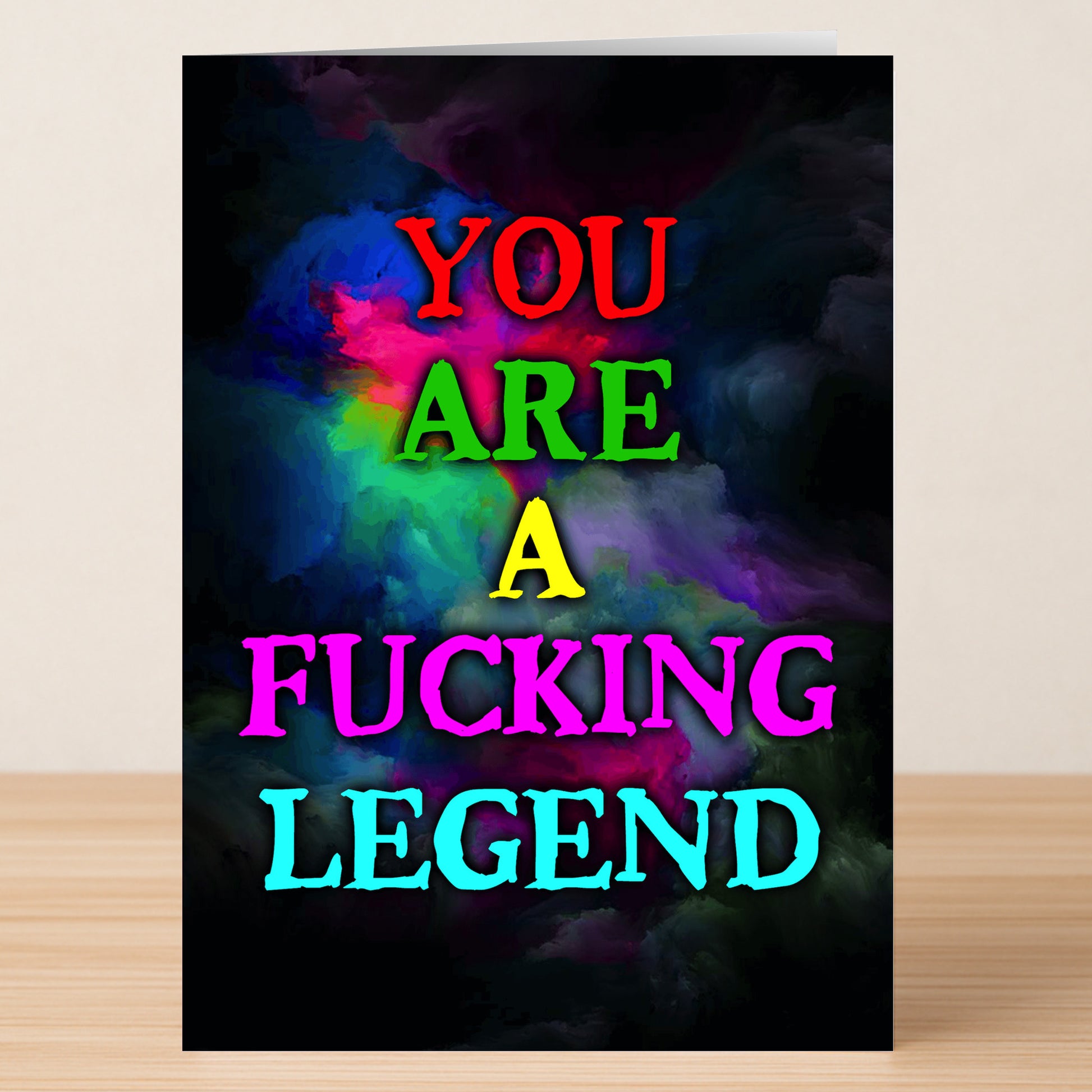 The Fucking Legend Funny Thank You Card by Twisted Gifts features "YOU ARE A FUCKING LEGEND" in bold, colorful letters on a dark, smoky multicolored background—perfect for making your gratitude unforgettable.
