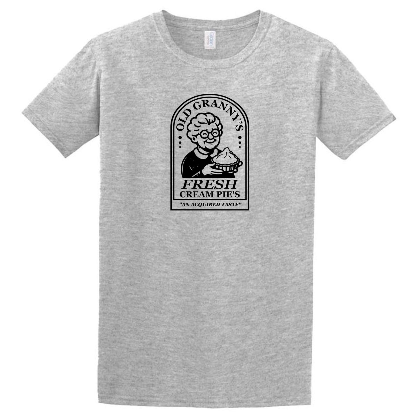 The Cream Pies T-Shirt by Twisted Gifts features a black graphic of an elderly woman with a pie, labeled "Old Granny's Fresh Cream Pies" and the tagline "An Acquired Taste." A quirky, funny shirt for those who love unique humor.