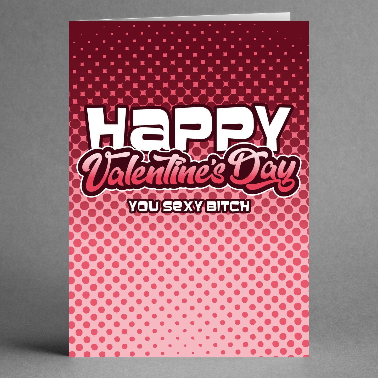 The Twisted Gifts "Sexy Bitch Funny Valentine's Card" features the text "Happy Valentine's Day, You Sexy Bitch" on a red and pink dotted gradient background, making it an ideal choice for anyone who enjoys a humorous take on Valentine's Day.