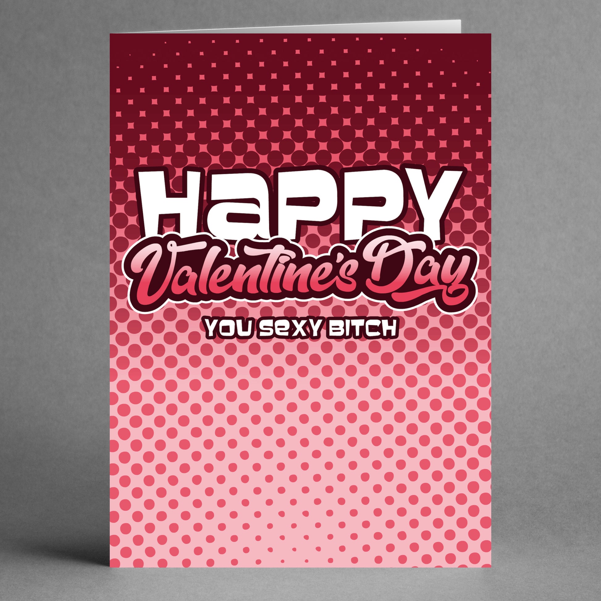 The Twisted Gifts "Sexy Bitch Funny Valentine's Card" features the text "Happy Valentine's Day, You Sexy Bitch" on a red and pink dotted gradient background, making it an ideal choice for anyone who enjoys a humorous take on Valentine's Day.