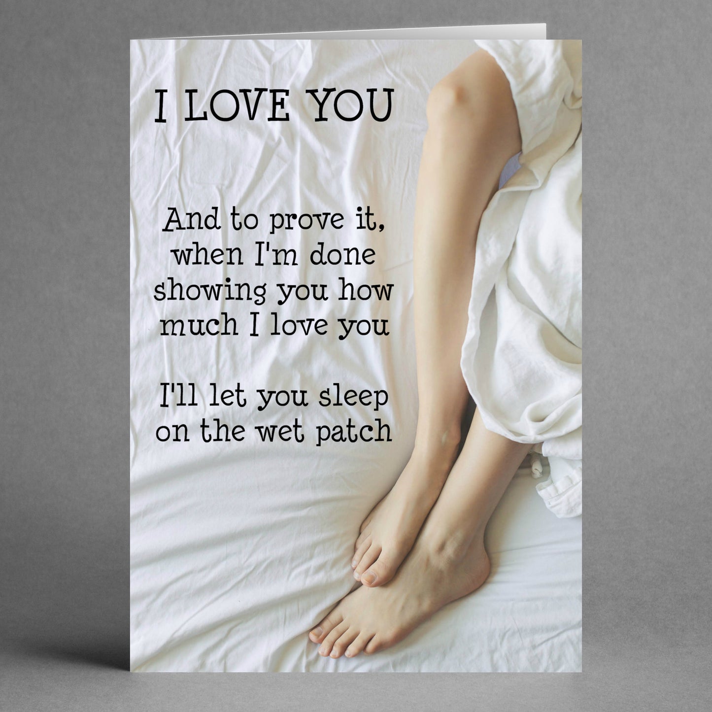 The "Wet Patch Rude Valentine's Card" by Twisted Gifts features the humorous text: "I LOVE YOU. And to prove it, when I'm done showing you how much I love you, I'll let you sleep on the wet patch," along with an image of legs on a white bed—ideal for those who enjoy humor in their Valentine's Day cards.