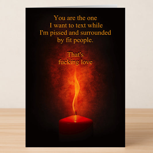 The That's Love Insulting Valentine's Card by Twisted Gifts is a funny greeting card with a red candle and orange smoke, featuring the text: "You are the one I want to text while I'm pissed and surrounded by fit people." Perfect for Valentine’s Day.