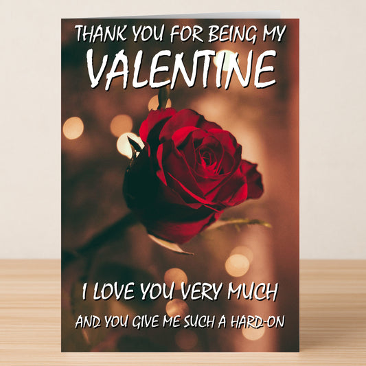 The Thank You Rude Valentine's Card by Twisted Gifts is a playful card featuring a red rose and the cheeky message: "Thank you for being my Valentine. I love you very much and you give me such a hard-on.