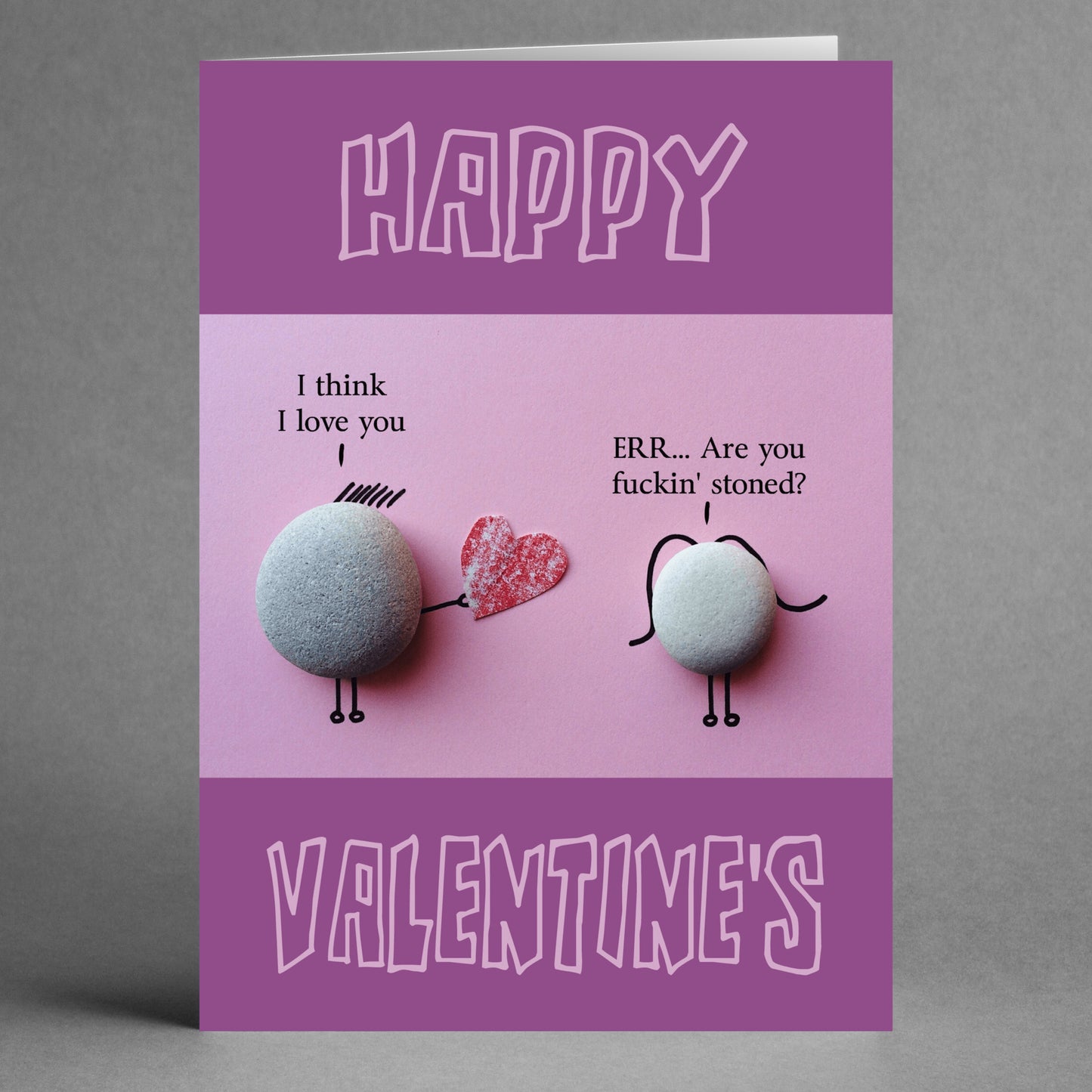 The "Stoned Funny Valentine's Card" by Twisted Gifts showcases a humorous exchange between two pebble figures. One figure states, "I think I love you," while the other humorously responds, "ERR... Are you f***in' stoned?" This clever wordplay adds a hilarious touch to your Valentine's greeting. The card also features "Happy Valentine's" above and below the illustration.