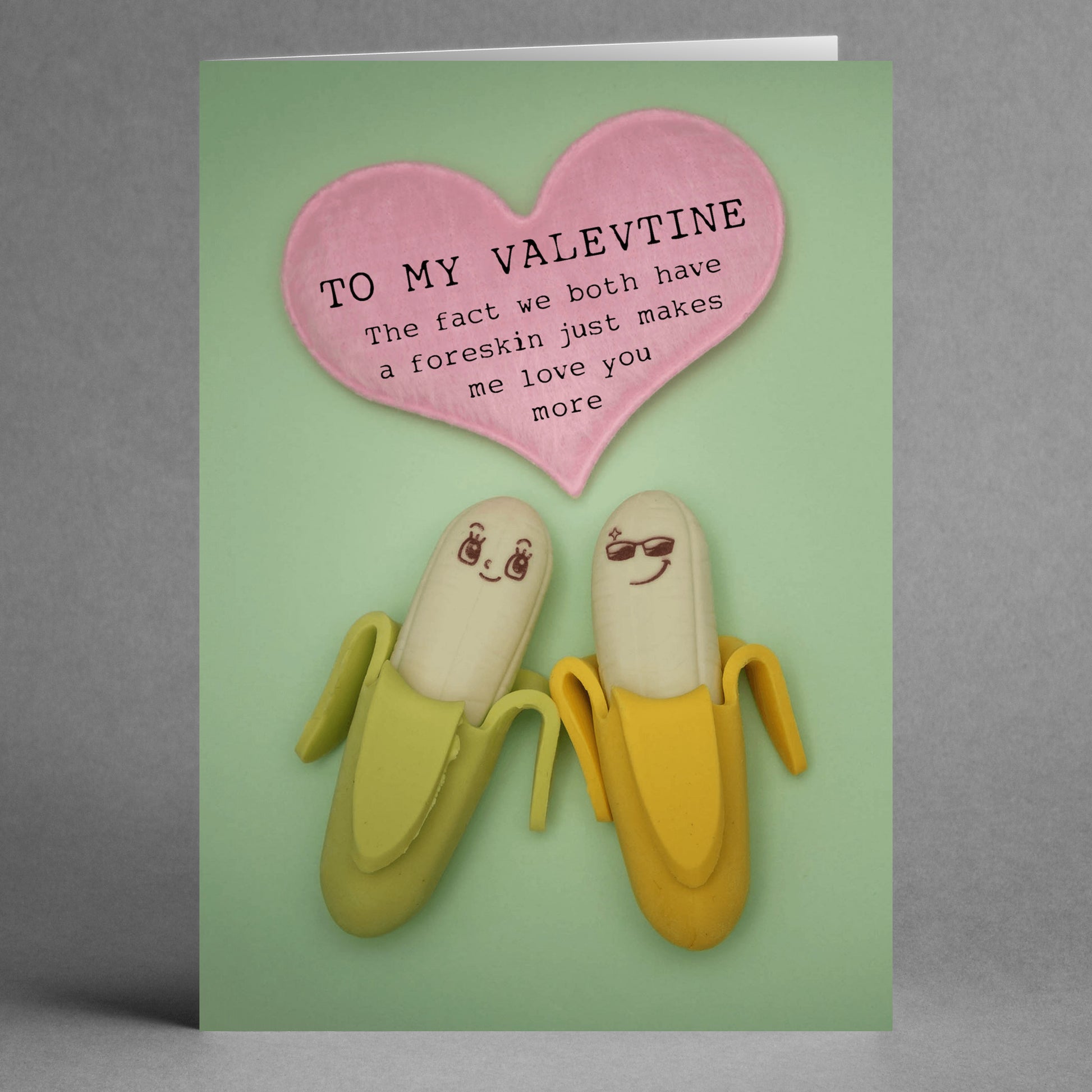 Check out the "Both Of Us Insulting Valentine's Card" by Twisted Gifts, featuring a duo of bananas—one peeled—with a heart above and a cheeky, sarcastic message about foreskin.