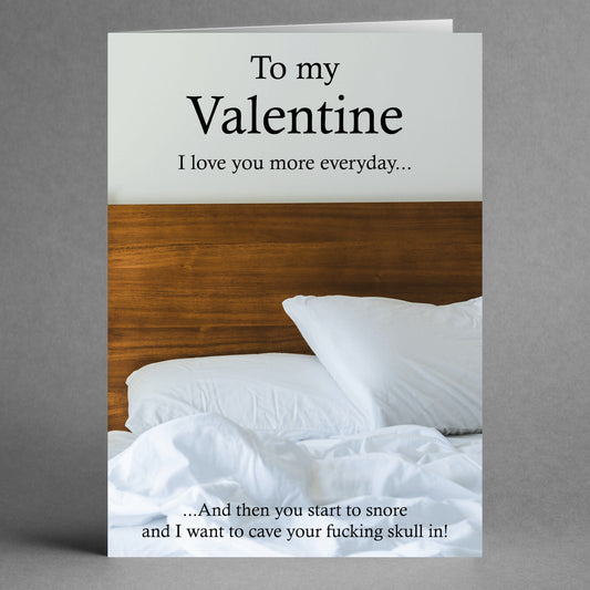 The Snore Funny Valentine's Card by Twisted Gifts showcases a cozy bed image paired with quirky humor, ideal for expressing love while playfully teasing your partner about their snoring. It’s perfect for those who cherish both laughter and affection in equal measure!