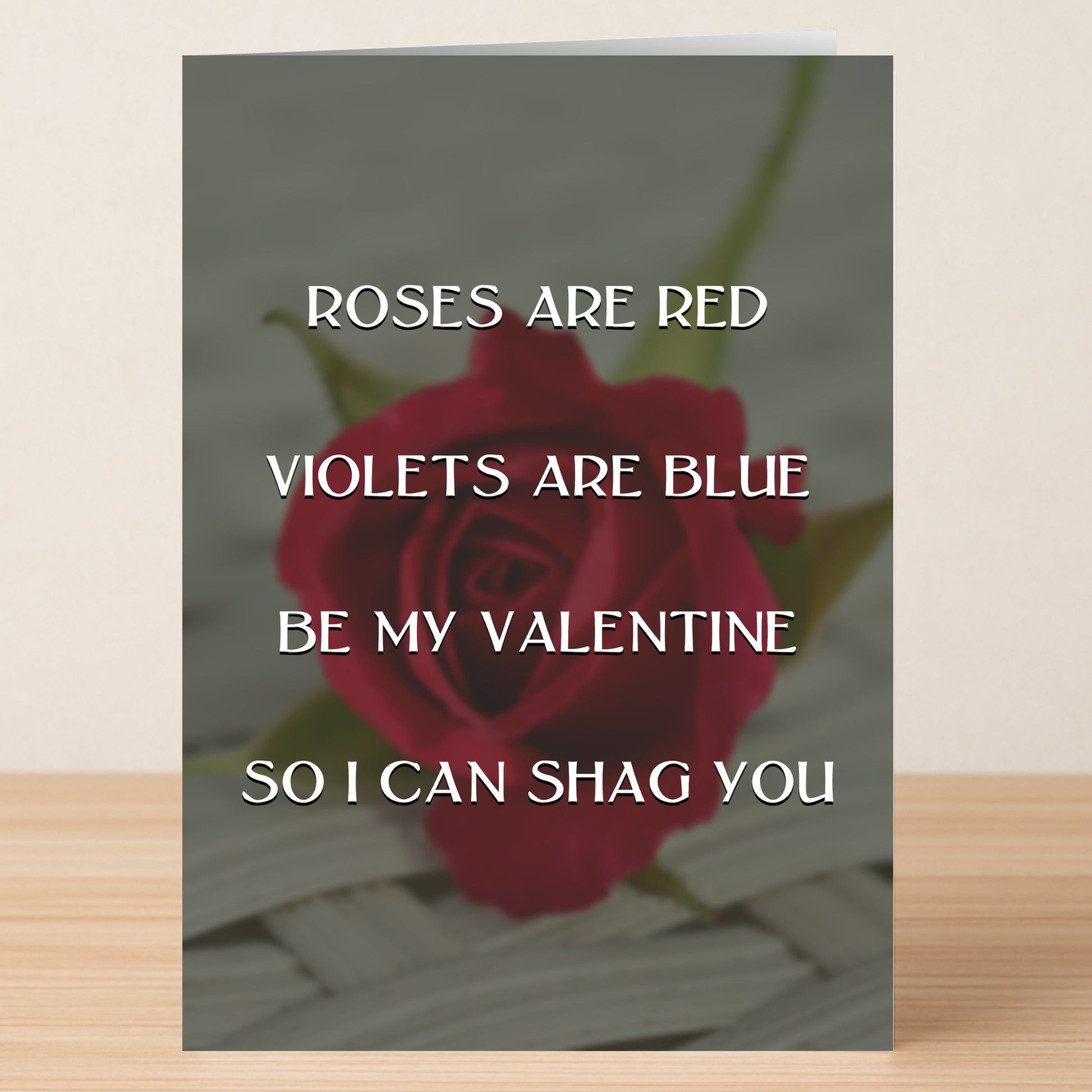 The Shag You Rude Valentine's Card by Twisted Gifts features a red rose and the cheeky message: "Roses are red, Violets are blue, Be my Valentine, So I can shag you.