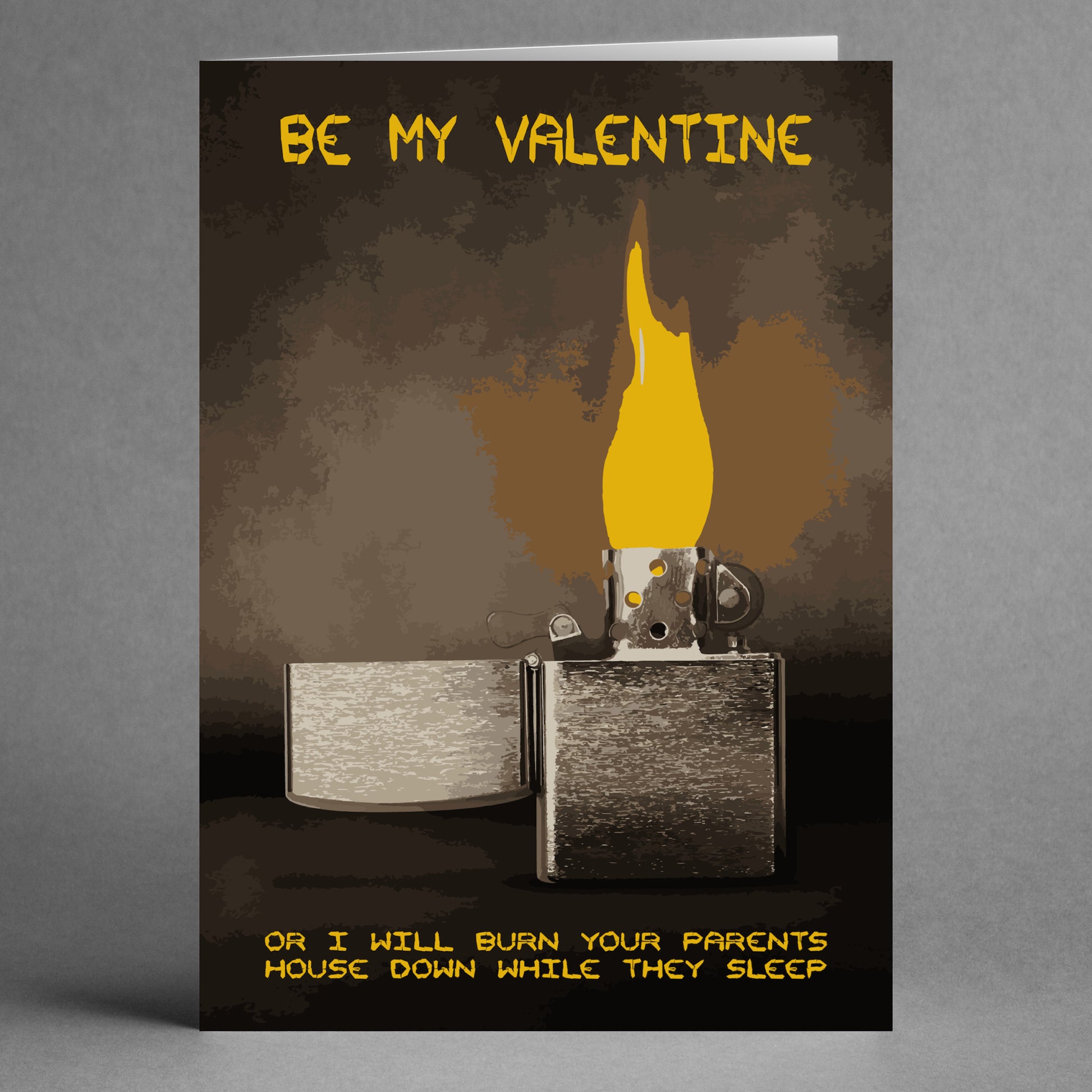 The "While they sleep" Wrong Valentine's Card by Twisted Gifts features an open lighter and flame with the cheeky message, "Be my Valentine or I will burn your parents' house down while they sleep." This unconventional card adds a darkly humorous twist to expressing love.